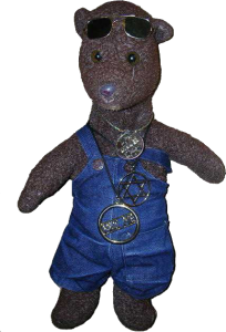 Bearsac wearing dungarees with one strap down.