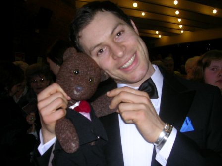 Singer Paul Pashley holding Bearsac