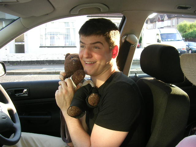 Actor James Alexandrou cuddling Bearsac in his car