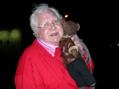 Ken Russell hugging Bearsac to his face.