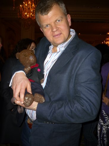 Photo Adrian Chiles holding Bearsac like a baby
