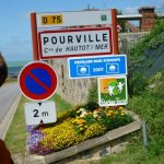 Bearsac looking at place sign for Pourville.