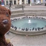 Bearsac beside a low fountain in Zagreb