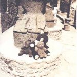 Bearsac, Choc-Ice and Rizla sitting on a mill stone in Pompeii