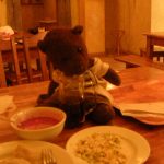 Bearsac sitting on table with Polish food.