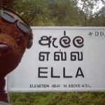 Bearsac in front a Ella place sign