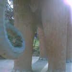 Bearsac sitting on the truck of a fibre-glass woolly mammoth