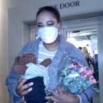 Pretty Yende holding Bearsac outside the Royal Opera House stage door