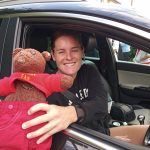 Teddy bear, Bearsac being held by Arsenal WFC player