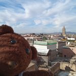 Bearsac the teddy bear in the foreground of Marrakech view