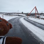 Bearsac the teddy bear in foreground of Red Pyramid Bridge