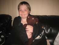 Little boys holding Mr Beans teddy