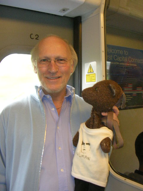 Colin Berry holding Bearsac on train