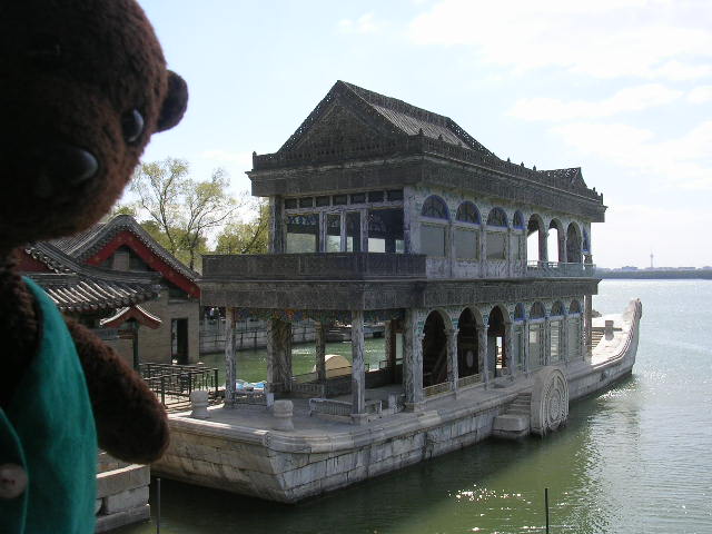 Bearsac beside Stone boat in lake