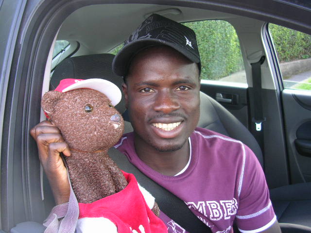 Emmanuel Eboue holding Bearsac in car window