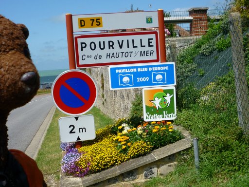 Bearsac looking at place sign for Pourville.