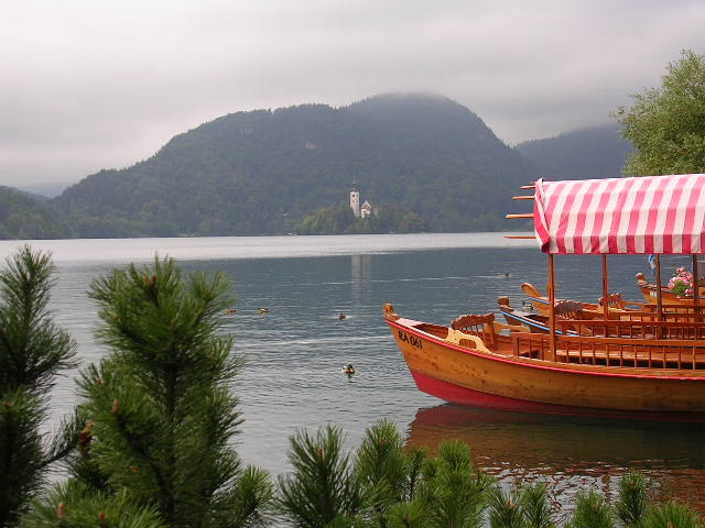 Tourist boat at moor on Lake Bled