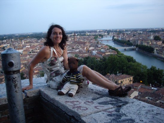 Debra and Bearsac on a wall with high view of Verona