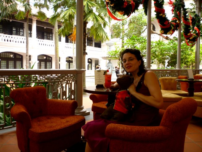 Debra and Bearsac with a Singapore Sling at Raffles Hotel