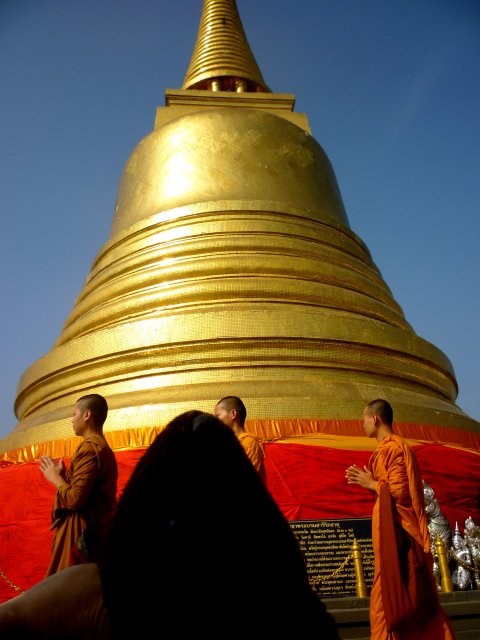 Temple dome and monks, with Bearac's muzzle echoing the shape of the dome