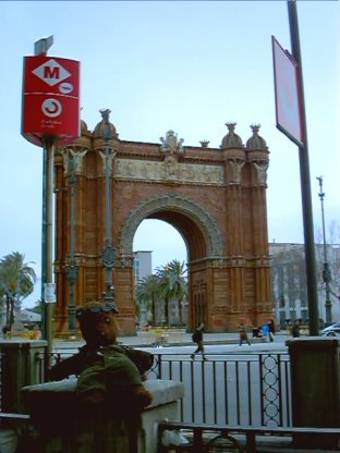 Bearac sitting in foreground o the Arc de triomph