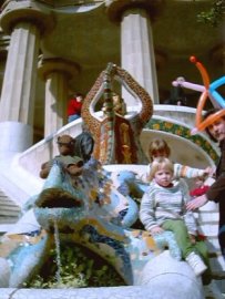 Bearsac sitting on a mosaic salamander statue