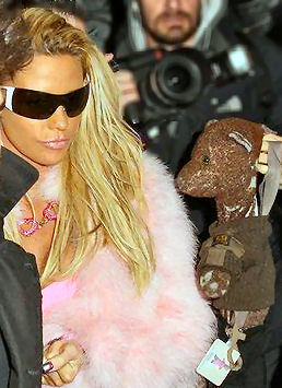 Katie Price in a fluff teddy bear jacket with Bearsac near her