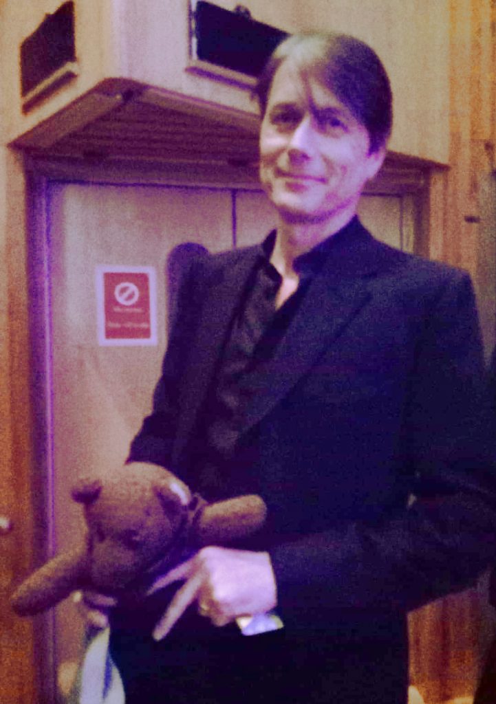 Brett Anderson standing holding Bearsac