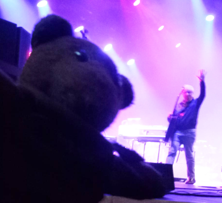 Bearsac in forgrownd Graham Gouldman in background on stage