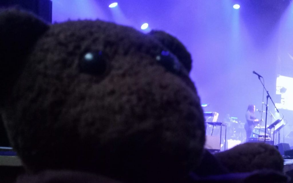 Bearsac appearing (by perspective) to have Zara McFarlane standing on his paw