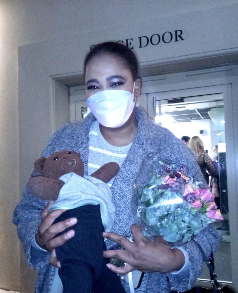 Pretty Yende holding Bearsac outside the Royal Opera House stage door