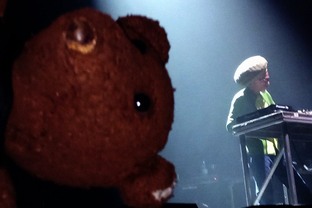 Bearsac's face in the foreground of Don Letts at mixing desk