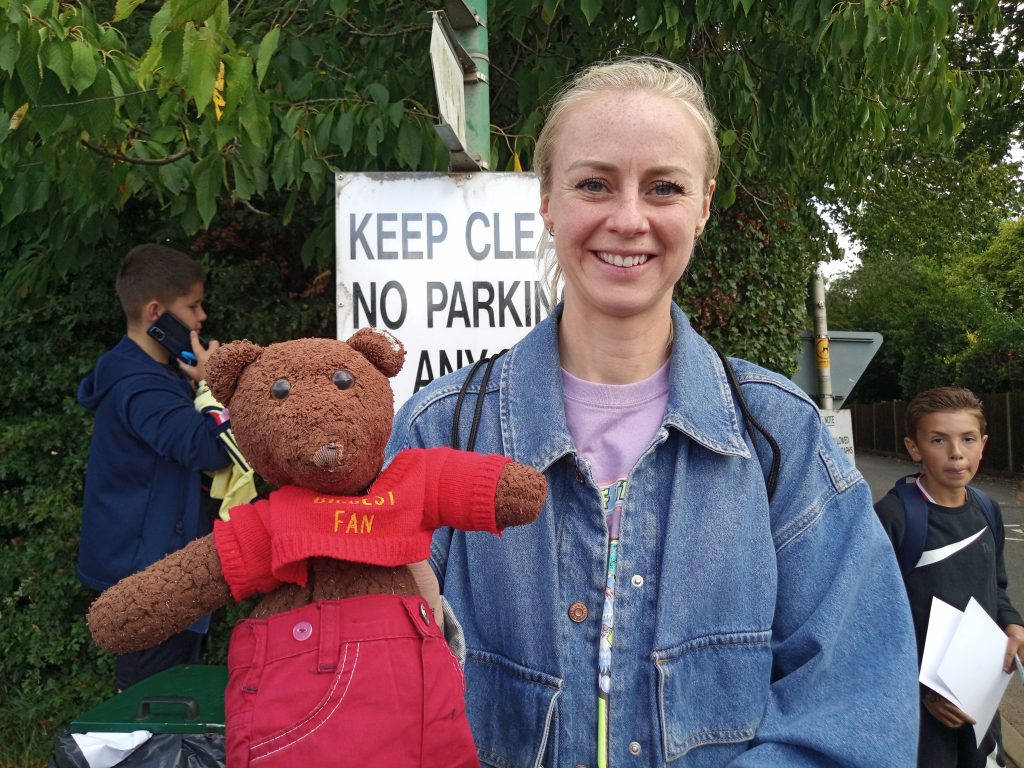 Teddy bear, Bearsac being held by Arsenal WFC player