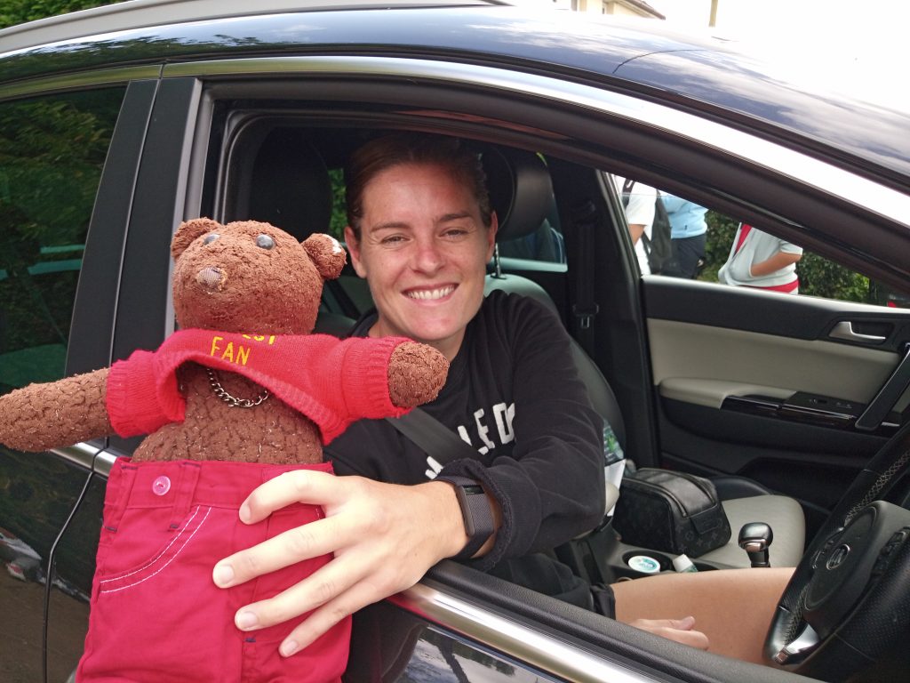 Teddy bear, Bearsac being held by Arsenal WFC player