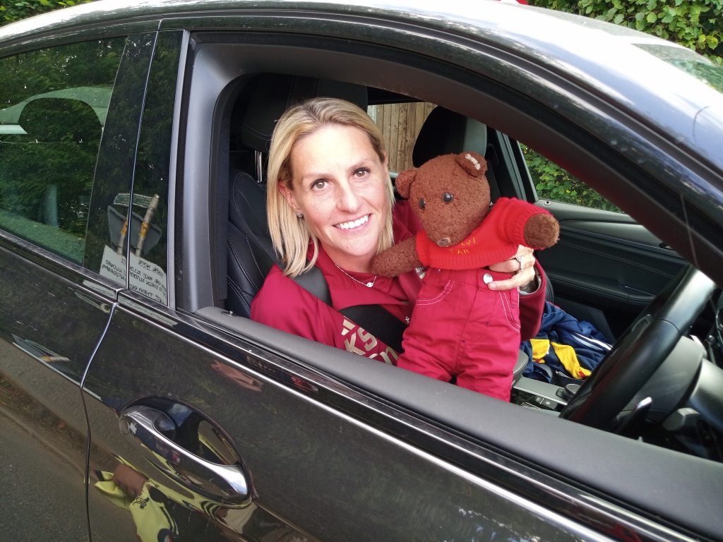 Teddy bear, Bearsac being held by Arsenal WFC player