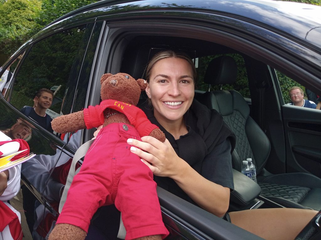 Teddy bear, Bearsac being held by Arsenal WFC player Steph Catley