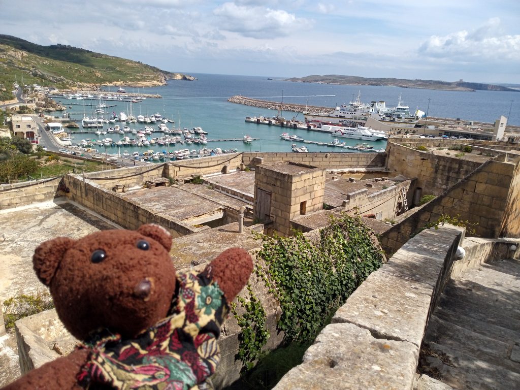 Building ansd sea view of Gozo with Bearsac in the forground