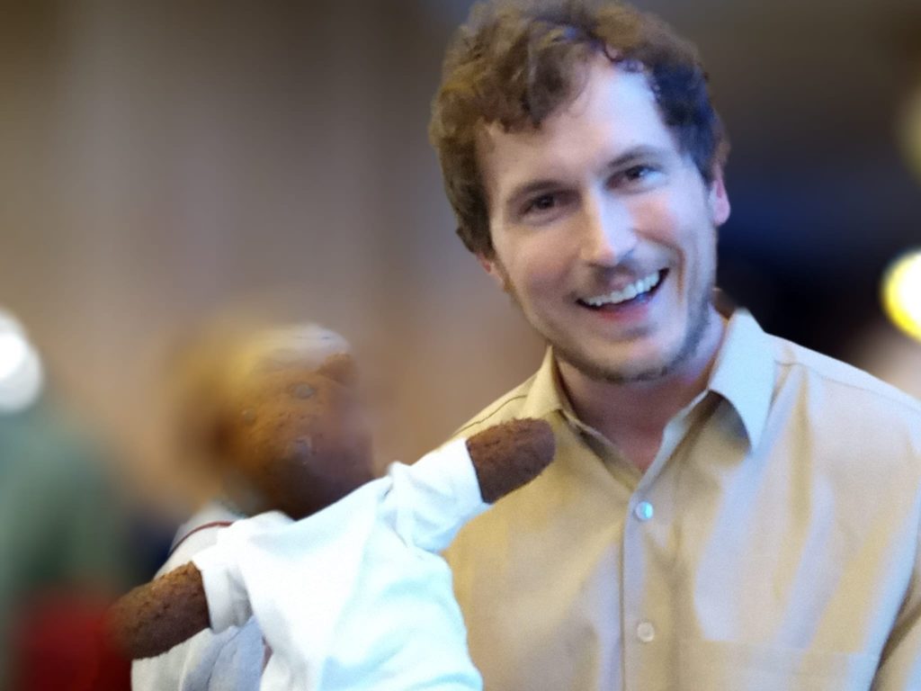 A blurred Bearsac being held by Jeff Rowe