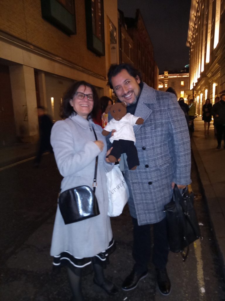 Jorge De Leon holding Bearsac the teddy bear