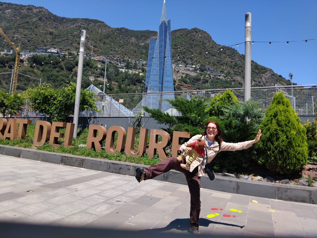 Teddy bear Bearsac being held by his mummy in the foreground of
