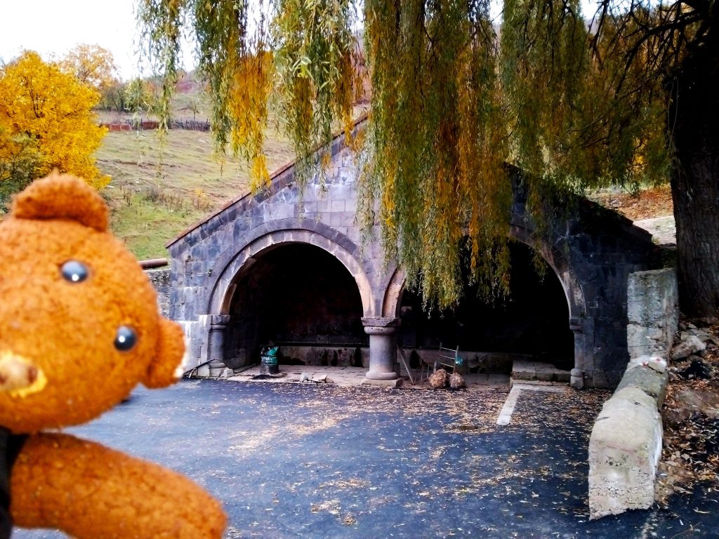 Bearsac the teddy bear in forground of 