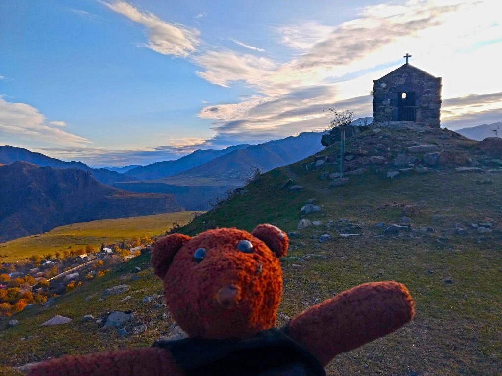 Bearsac the teddy bear in forground of 