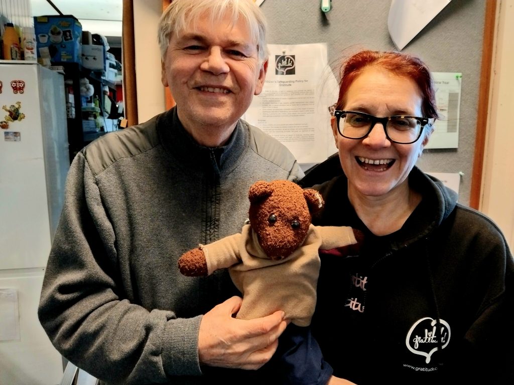 John Robertson holding Bearsac next to Mummy Debra