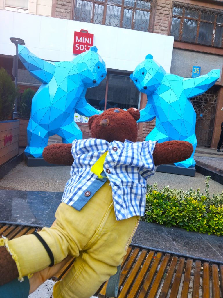 Bearsac the teddy bear in the foreground of fibreglass bears