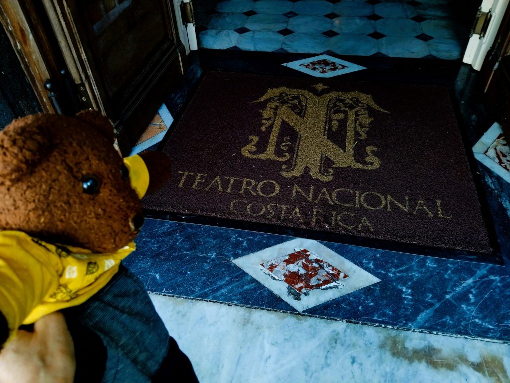 Bearsac the teddy bear in foreground of Teatro Nacional doormat