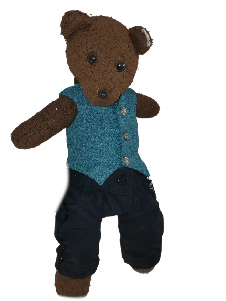 Bearasc the teddy bear wearing a green waistcoat and black trousers.