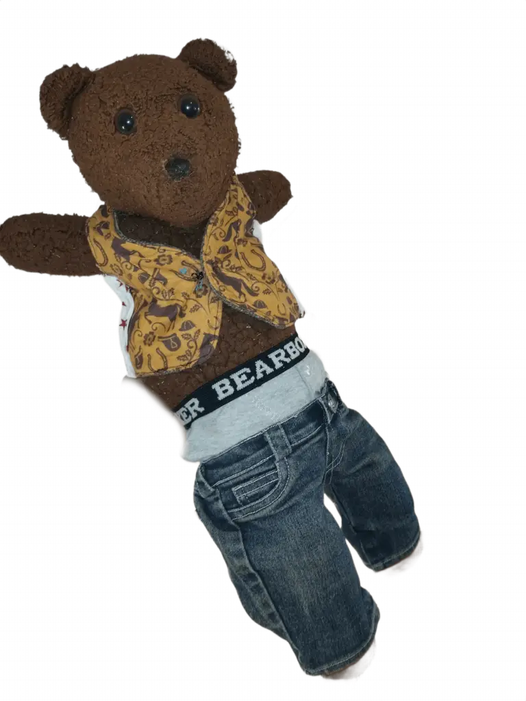 Bearasc the teddy bear wearing a light orange waistcoat, blue jeans and bear boxers sticking out over the top