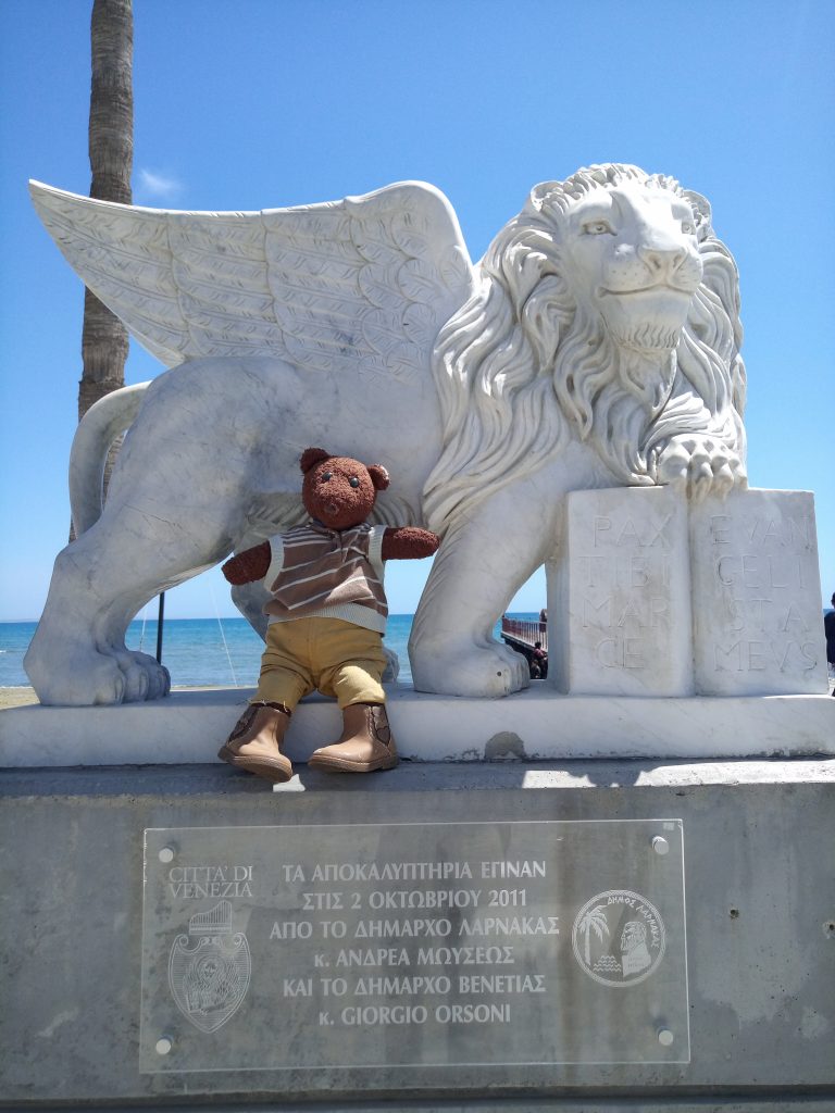 Bearsac the teddy bear standing in front of